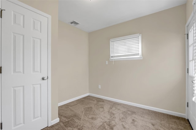 unfurnished bedroom with light colored carpet