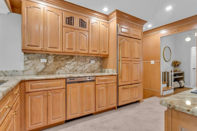 kitchen with tasteful backsplash, light stone counters, and crown molding