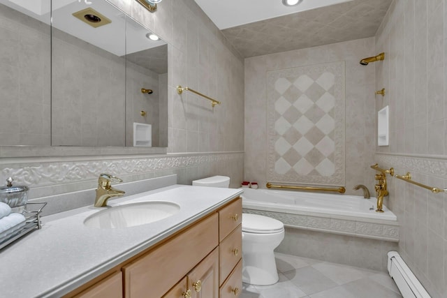 full bathroom featuring vanity, tile patterned floors, tiled shower / bath combo, tile walls, and a baseboard radiator