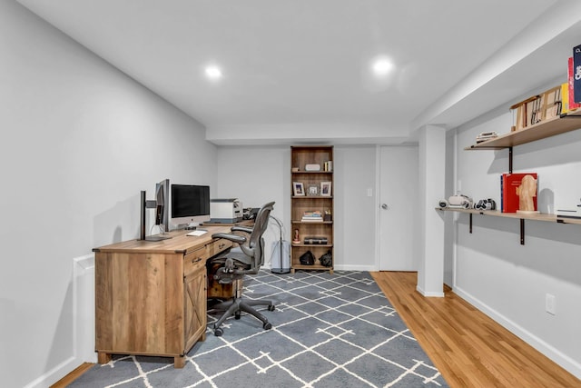 home office featuring dark hardwood / wood-style flooring