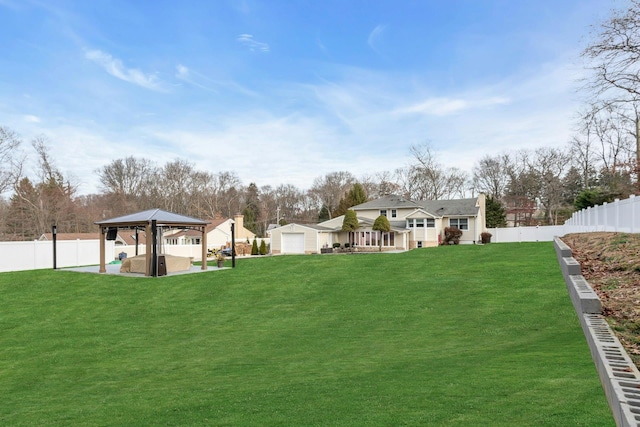 view of yard featuring a gazebo and a garage