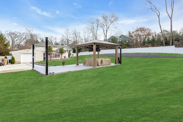 view of yard with an outbuilding, a gazebo, and a garage