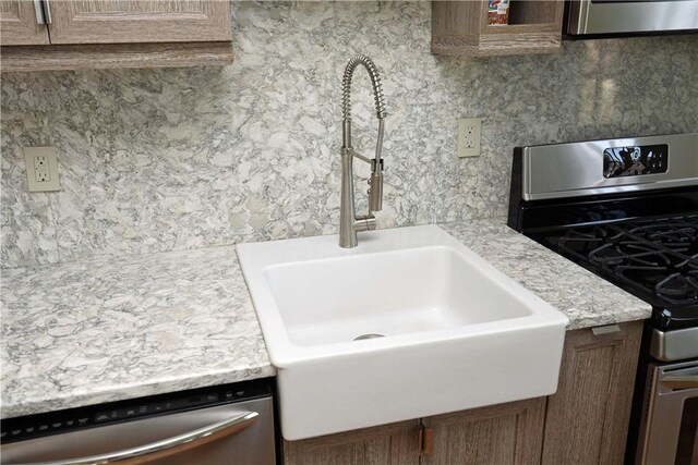 room details featuring sink and stainless steel appliances