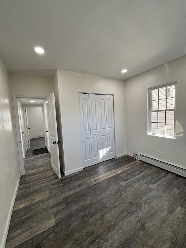 unfurnished bedroom featuring recessed lighting, dark wood finished floors, and baseboards