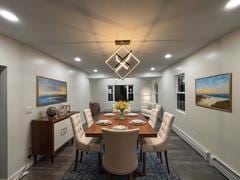 dining space with a baseboard radiator, baseboards, and recessed lighting