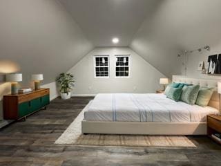 bedroom featuring lofted ceiling and wood finished floors