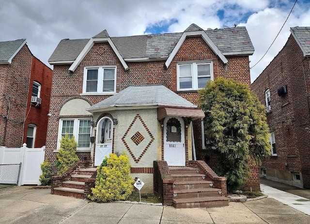 95-07 239th St, Floral Park, NY 11001 - tudor house with fence and brick siding
