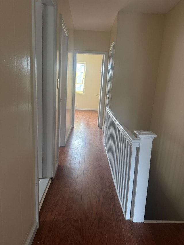 95-07 239th St, Floral Park, NY 11001 - hallway featuring wood-type flooring and an upstairs landing