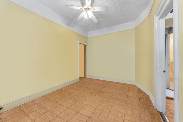 unfurnished room featuring ceiling fan, a textured ceiling, and light parquet flooring