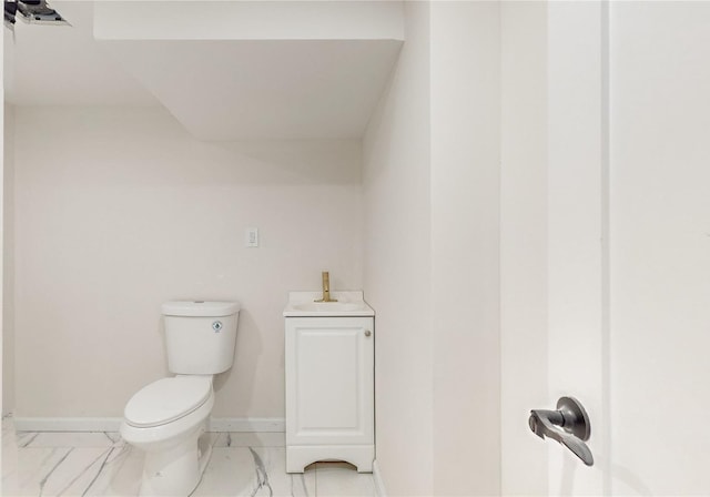 bathroom with toilet and sink