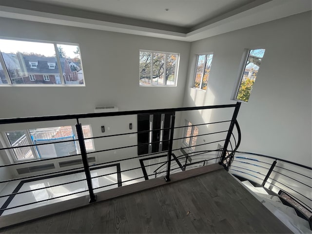 stairs with hardwood / wood-style flooring