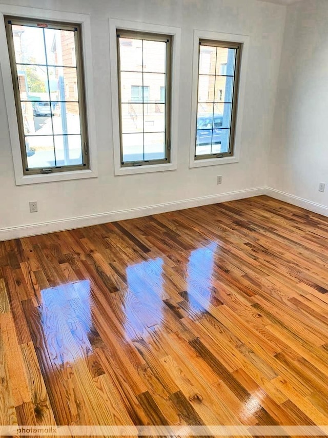 unfurnished room featuring light hardwood / wood-style flooring