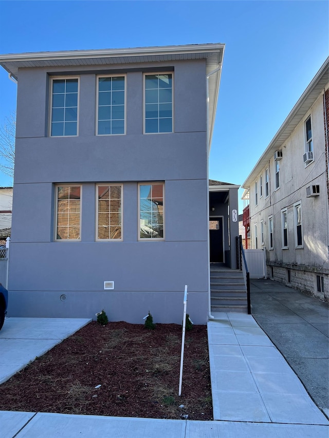 view of front of home featuring cooling unit