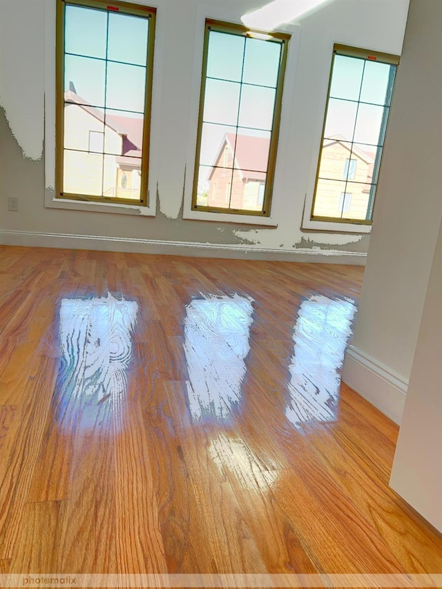 unfurnished room featuring light wood-type flooring