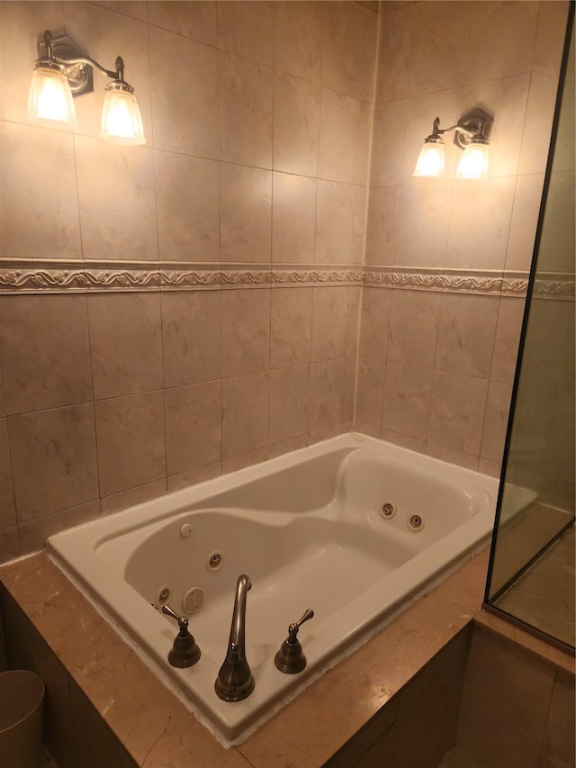 bathroom with tiled tub