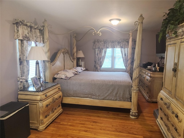 bedroom featuring wood-type flooring