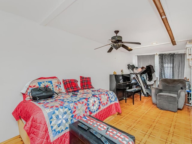 bedroom featuring beamed ceiling and ceiling fan