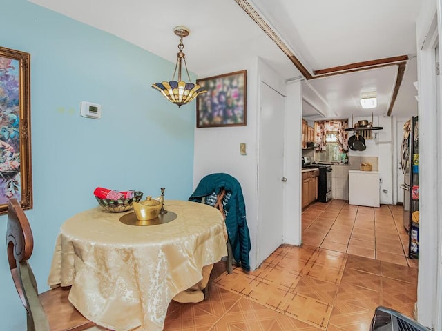 dining space featuring an inviting chandelier