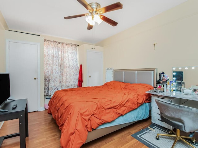 bedroom with ceiling fan and light hardwood / wood-style flooring