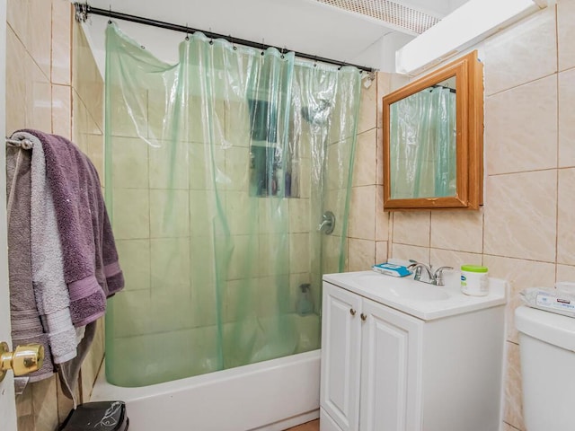 full bathroom with decorative backsplash, shower / tub combo, vanity, tile walls, and toilet