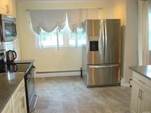 kitchen featuring stainless steel appliances and a baseboard radiator