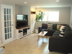 living room with a baseboard radiator