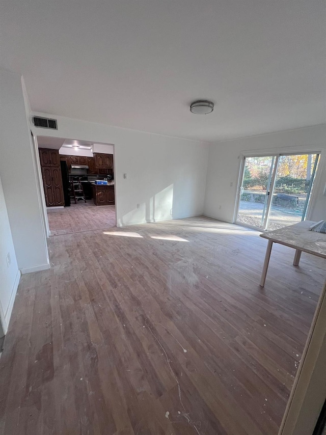 unfurnished living room featuring light hardwood / wood-style floors