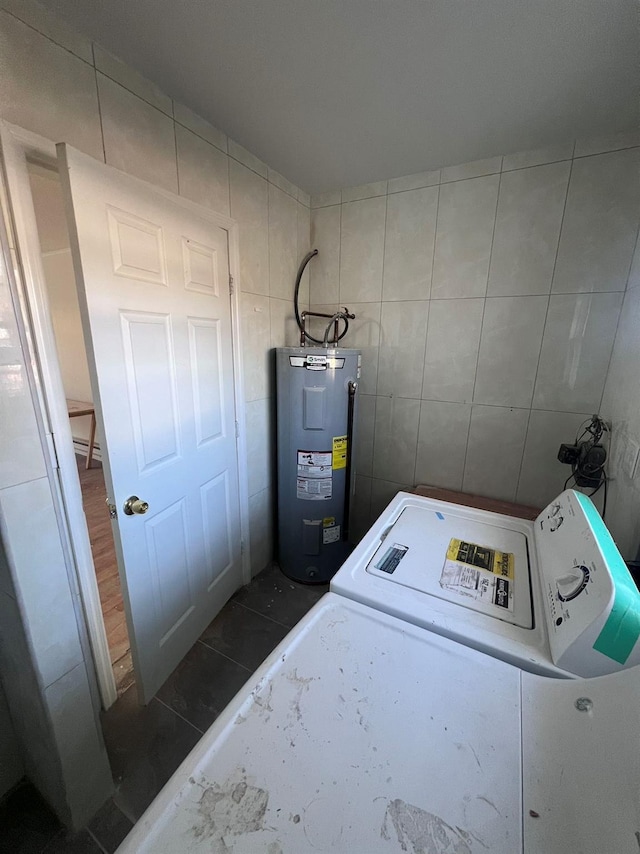 washroom with electric water heater, tile walls, and washer / clothes dryer