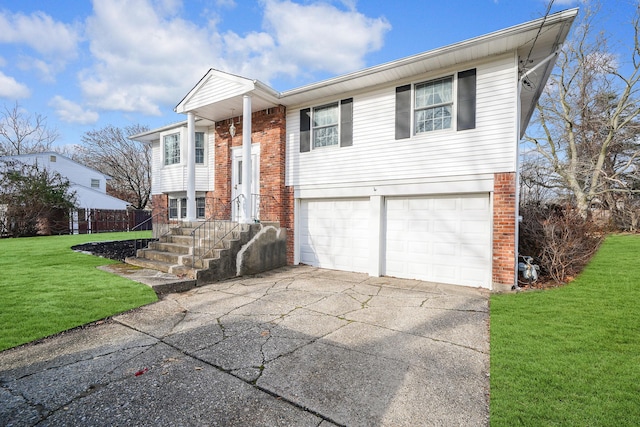 bi-level home with a garage and a front lawn