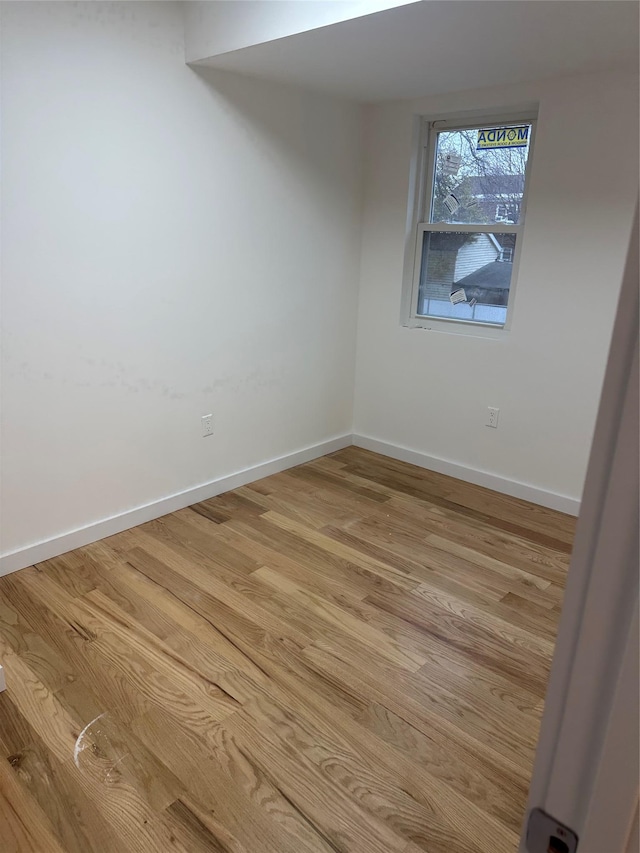 unfurnished room with light hardwood / wood-style flooring