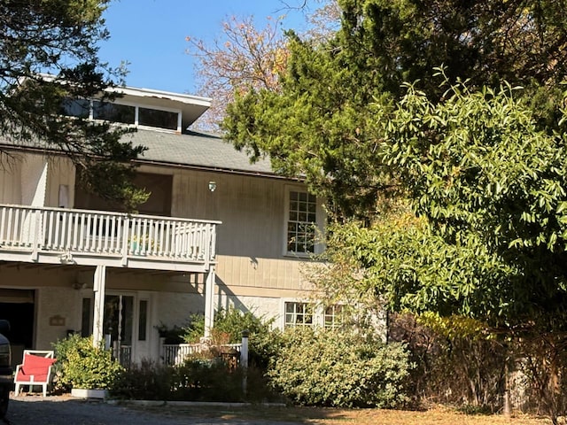 back of house with a balcony