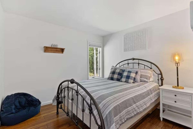 bedroom featuring dark wood-type flooring
