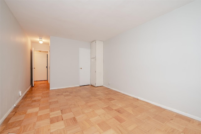 spare room with light parquet flooring