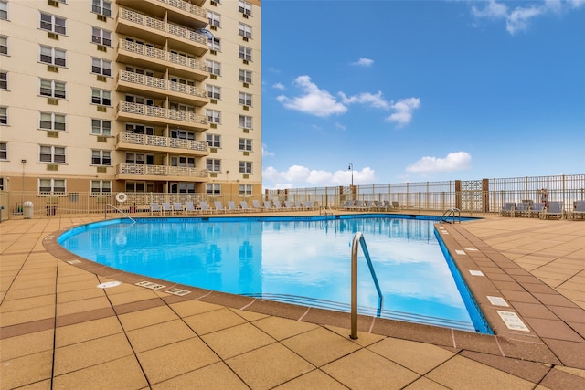 view of swimming pool with a patio area