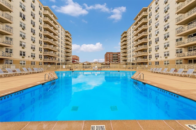 view of swimming pool with a patio