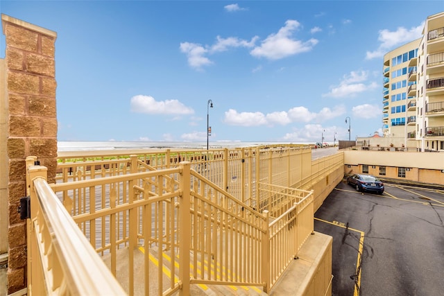 wooden deck with a beach view