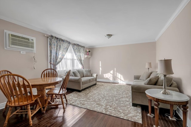 living room with wood-type flooring, a wall unit AC, and crown molding