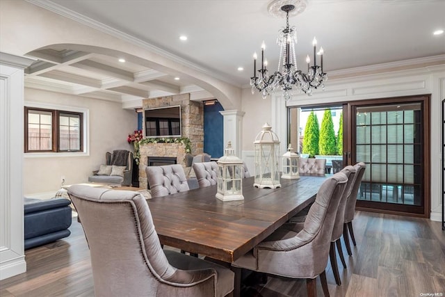 dining area with coffered ceiling, ornate columns, a fireplace, beam ceiling, and dark hardwood / wood-style flooring