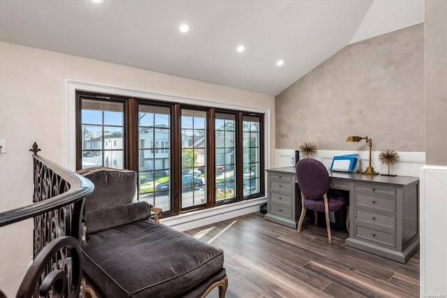 home office with dark hardwood / wood-style flooring, plenty of natural light, and vaulted ceiling