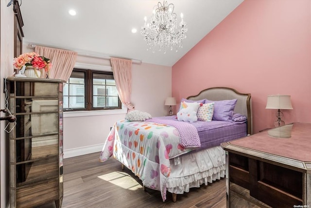 bedroom featuring an inviting chandelier, dark hardwood / wood-style flooring, and vaulted ceiling