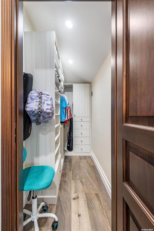 spacious closet with light wood-type flooring