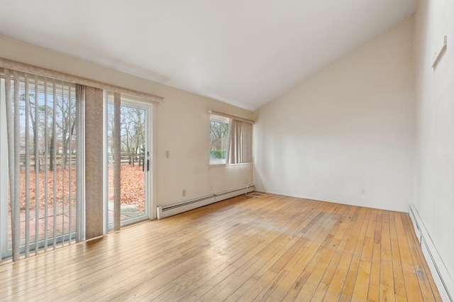 unfurnished room featuring vaulted ceiling, a baseboard radiator, and light hardwood / wood-style flooring