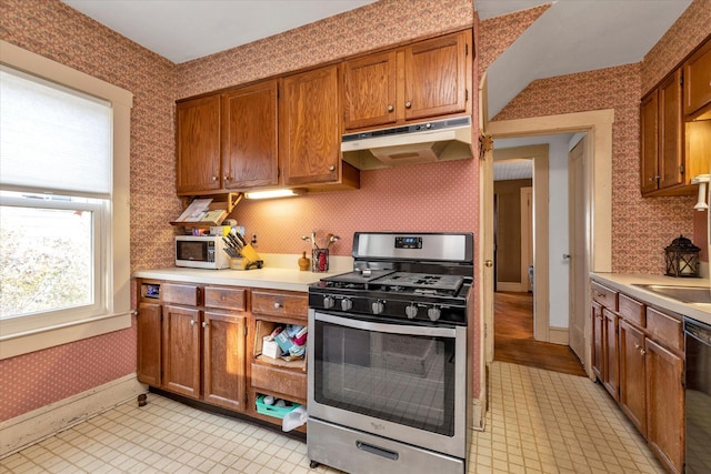 kitchen featuring black dishwasher and stainless steel range with gas stovetop