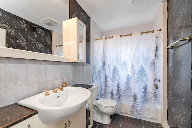 full bathroom with vanity, tile walls, and shower / bath combo with shower curtain