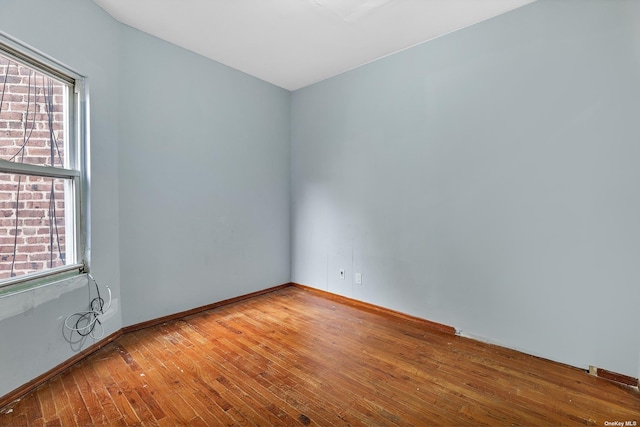 empty room featuring wood-type flooring