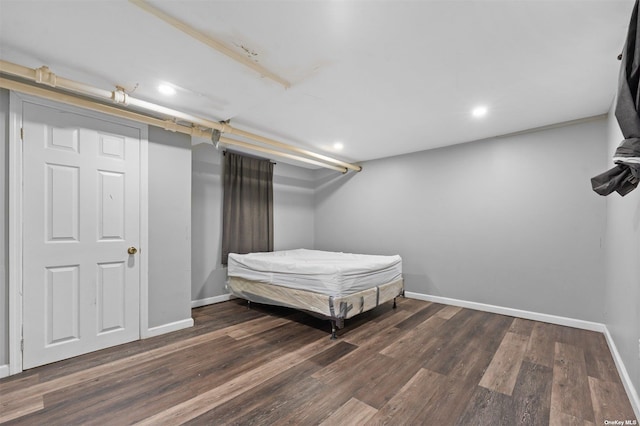 unfurnished bedroom featuring dark hardwood / wood-style flooring