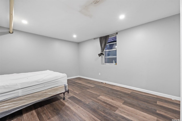 bedroom with hardwood / wood-style floors