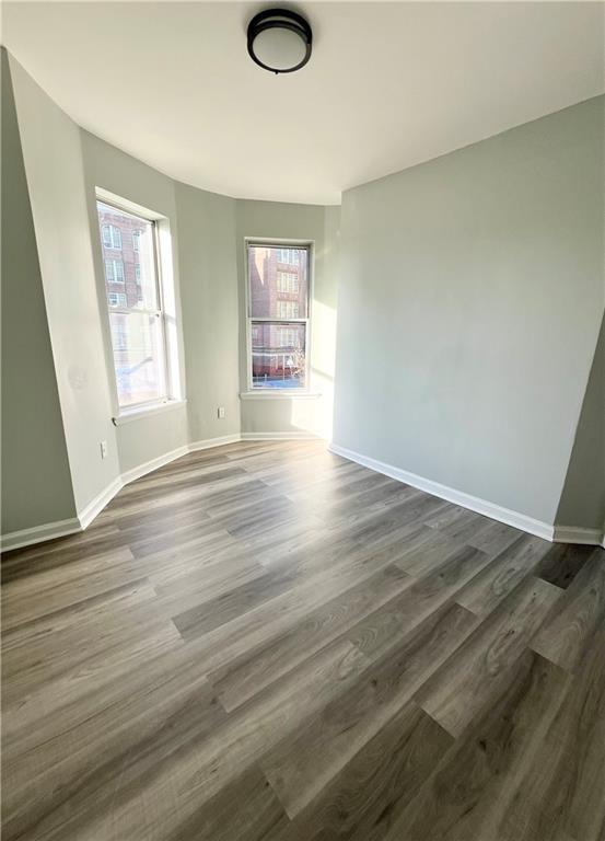 empty room featuring dark hardwood / wood-style floors