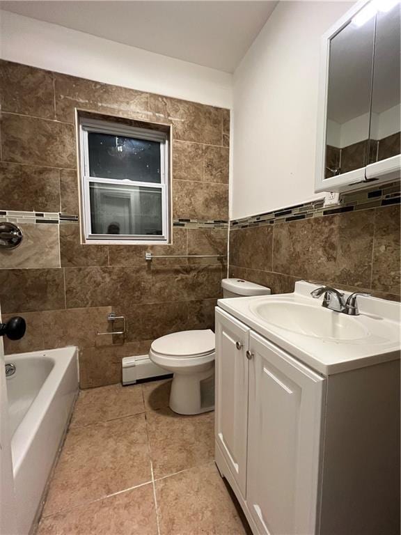 bathroom featuring vanity, baseboard heating, tile walls, tile patterned flooring, and toilet