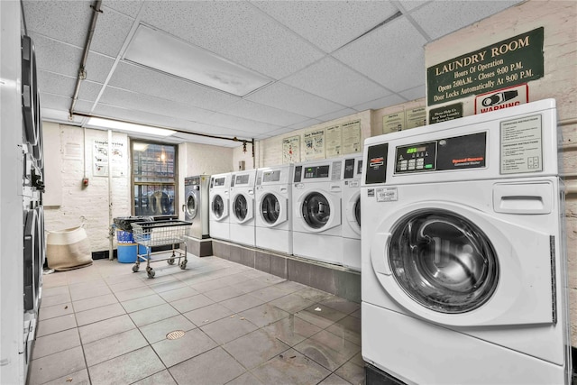 laundry area featuring tile patterned flooring and independent washer and dryer